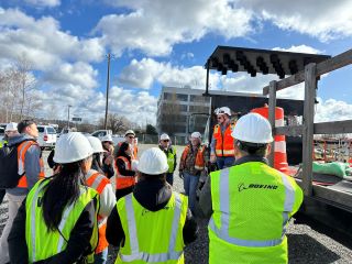 Delegation observing an attenuator. 
