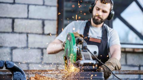 worker using a loud tool